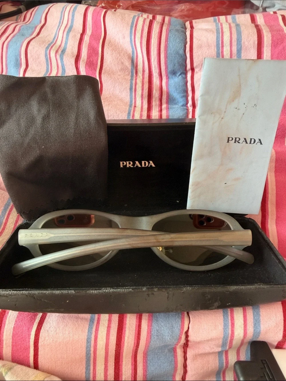 Prada Silver Oval Sunglasses with Brown-Tinted Lenses
